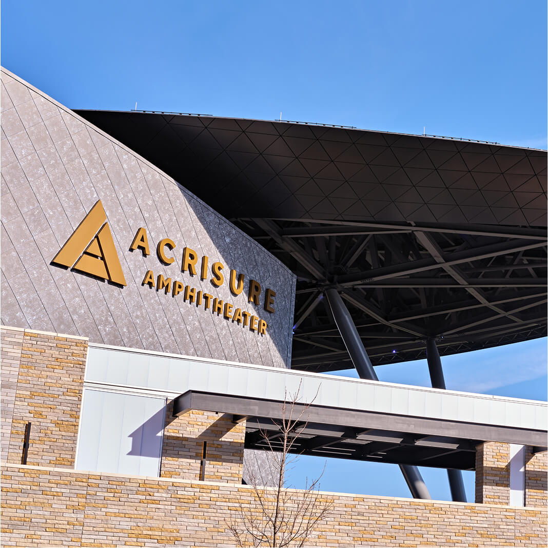Exterior of Arcisure Amphitheater in Grand Rapids, MI showcasing branded signage.