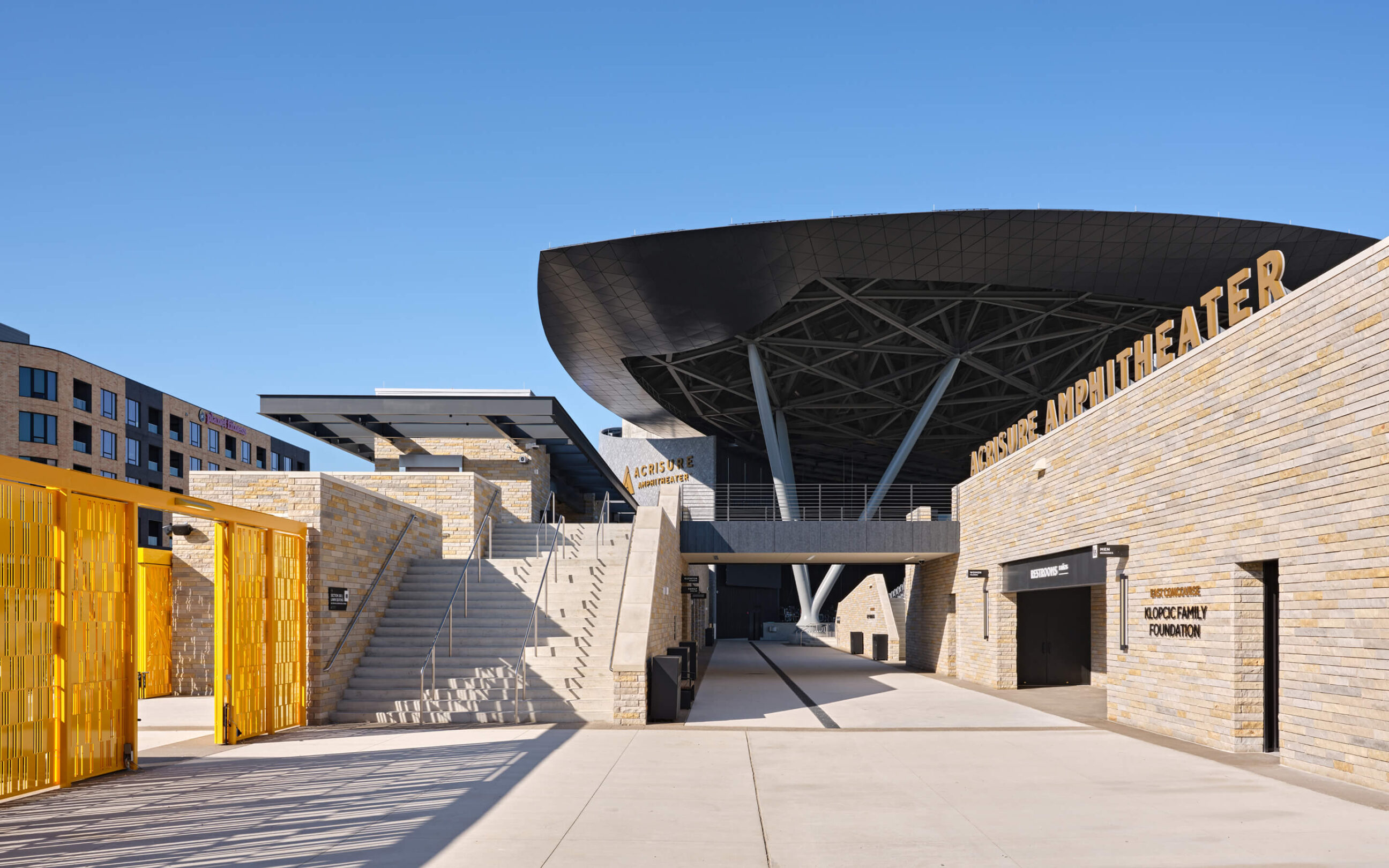 Interior of Acrisure Amphitheater highlighting the signage and wayfinding design.