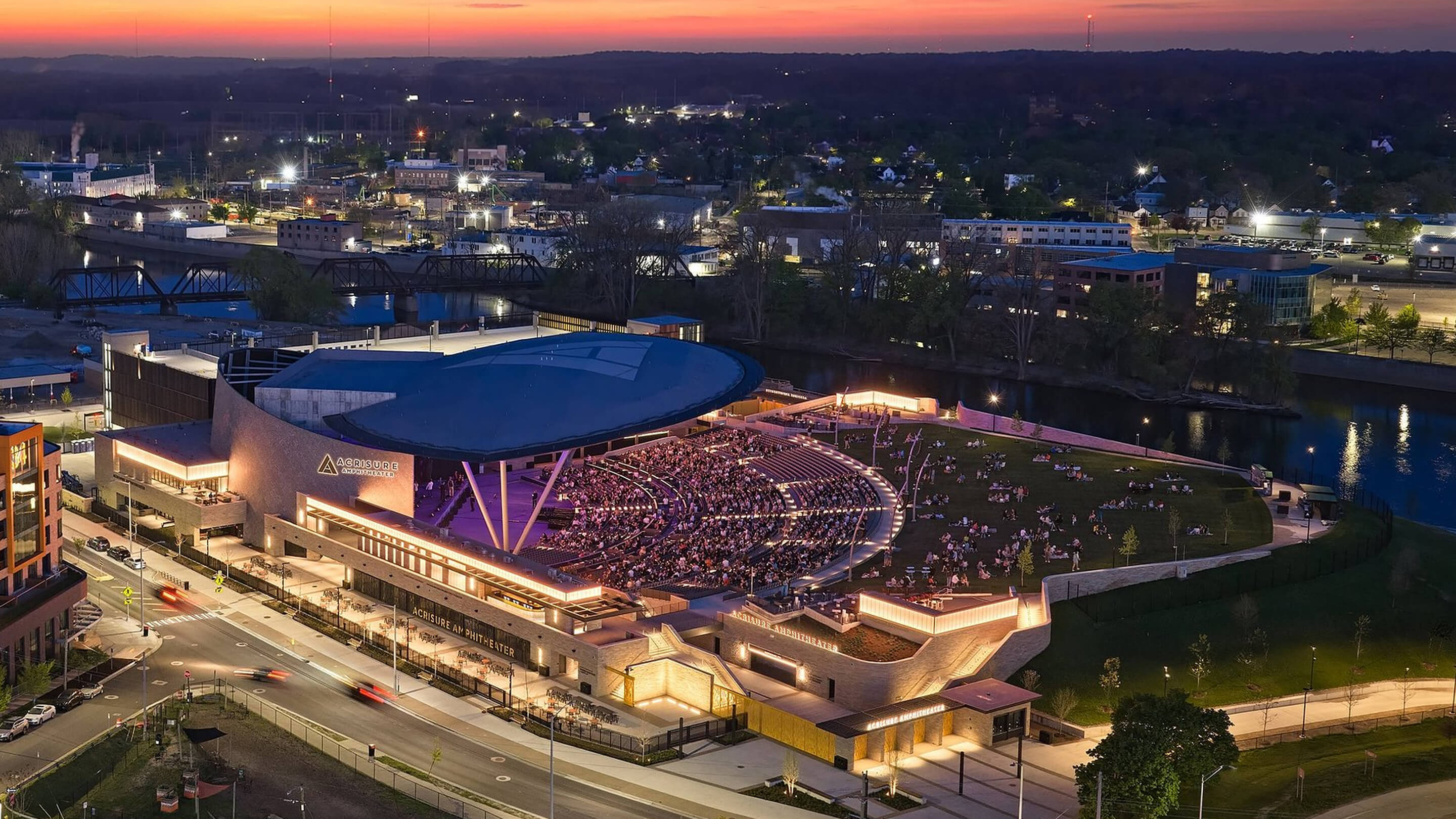 Aerial view showcasing the integrated signage and wayfinding system for Acrisure Amphitheater within the surrounding riverfront district.