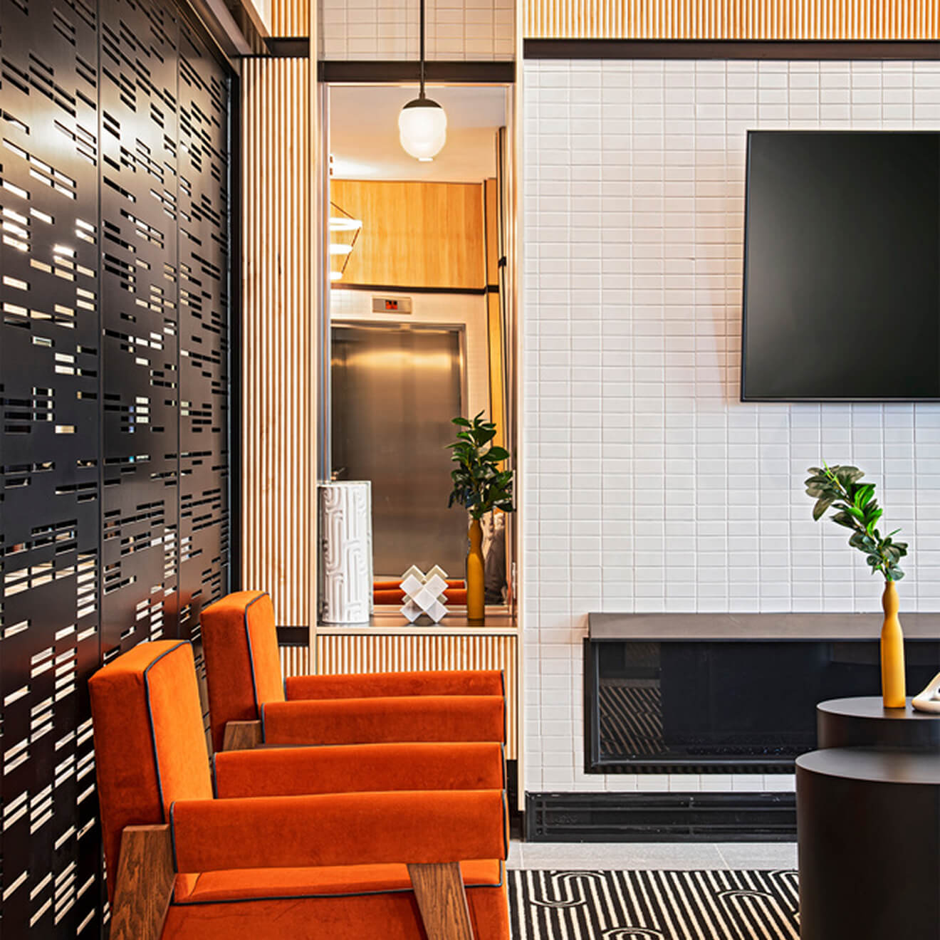 Interior of a high-end multi-family residential lobby with custom signage and wayfinding