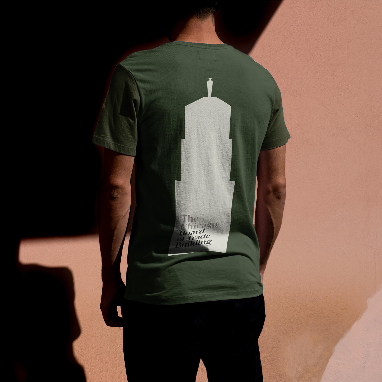 A person wearing a branded tee shirt for the Chicago Board of Trade Building